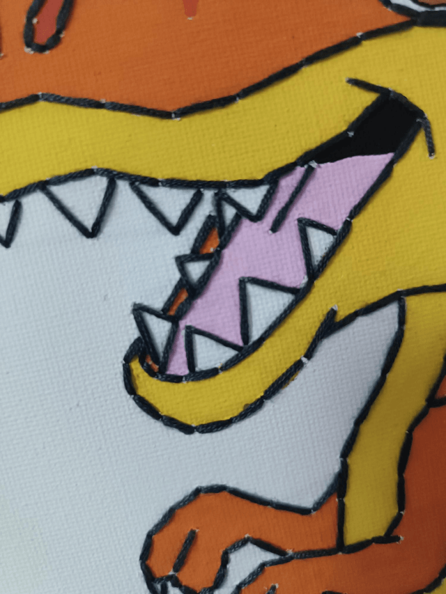 Toile brodée dinosaure 