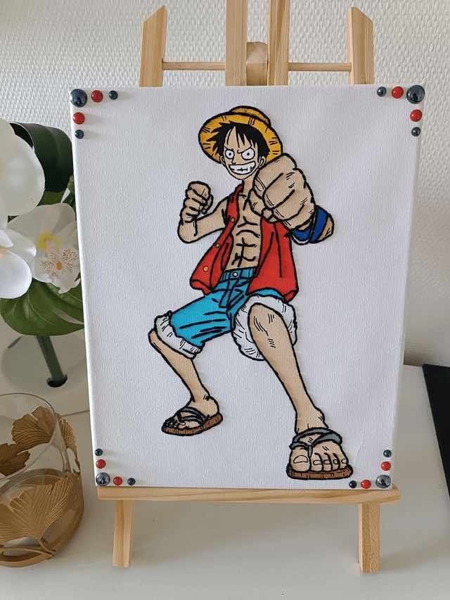 Toile brodée personnage L